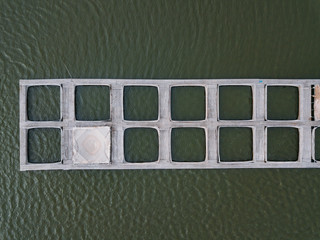 Cages for sturgeon fish farming in natural river or pond, top view