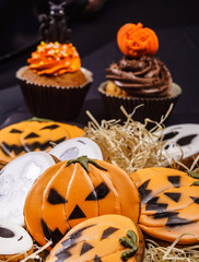 Halloween gingerbread cookies on the black background