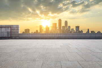 Empty square floor and modern city skyline in chongqing at sunset,China.