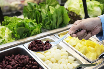 Red bean,fruits,and vegetable salad in stianless trays