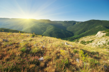 Mountain valley during sunrise.