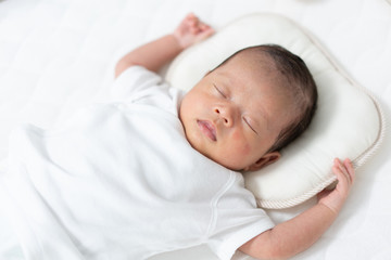 Baby sleeping on a crib