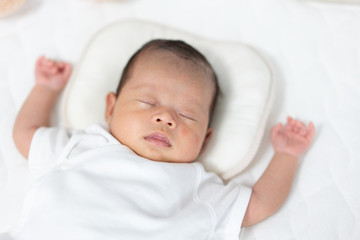 Baby sleeping on a crib