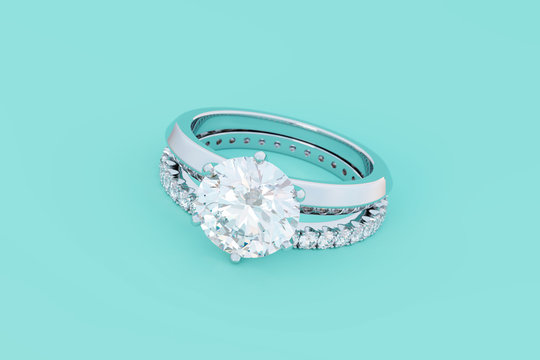 Solitaire diamond engagement ring, scallop set wedding band on turquoise background