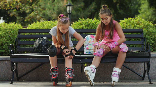 Young Teen Girls Preparing For Roller-skating