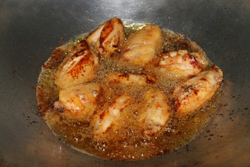 Fried chicken in hot oil and boiling in pan