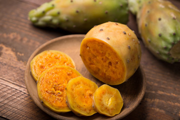 cactus fruit over wooden background