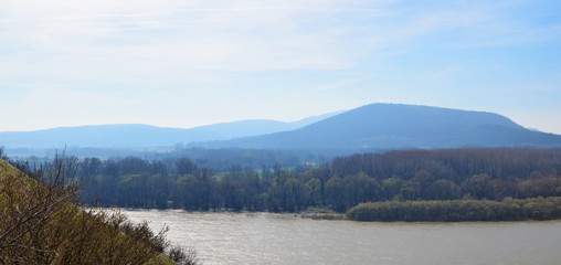 Panoramic March European landscape with river and mountais