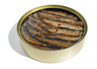 Open tin can with smoked sprats in oil on a white table isolated