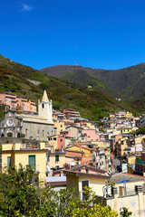 Fototapeta na wymiar View of the houses in the Riomaggiore town. One of five famous centuries-old colorful villages of Cinque Terre National Park in Liguria, region of Italy.