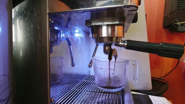 Makeing fresh coffee with coffee matchine.