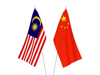 National fabric flags of China and Malaysia isolated on white background. 3d rendering illustration.