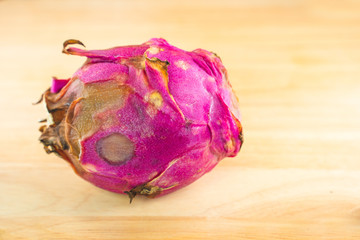 Dragon fruit. The rare dragon fruit on a wooden background