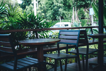 Table and chairs in a tropical garden