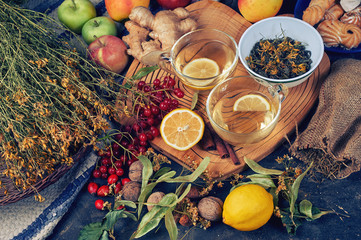 Two cups of medicinal herbal tea with ginger, lemon, cinnamon and lime.  Tonic and therapeutic hot...