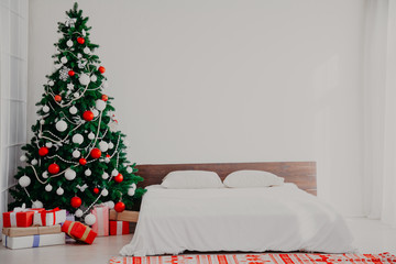 Christmas new year tree Interior bedroom and bed with gifts