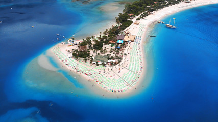 Blue lagoon beach in aegean sea near the village Oludeniz, Turkey. It is one of the world most beautiful beaches. Millions of travel tourists visit this place every year. Located near the Fethiye. © Dmytro