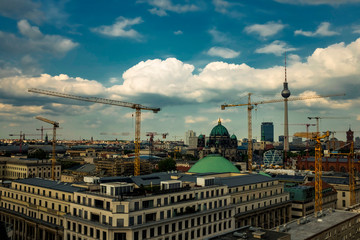 Panorama of Berlin center with many construction cranes, Germany. May 2014