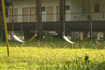 Empty swing in the children playground