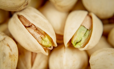 Salty pistachios. Selective focus. Tasty nuts. Popular snack.