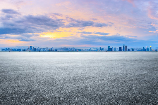 Sunset cityscape and empty asphalt road in Chongqing