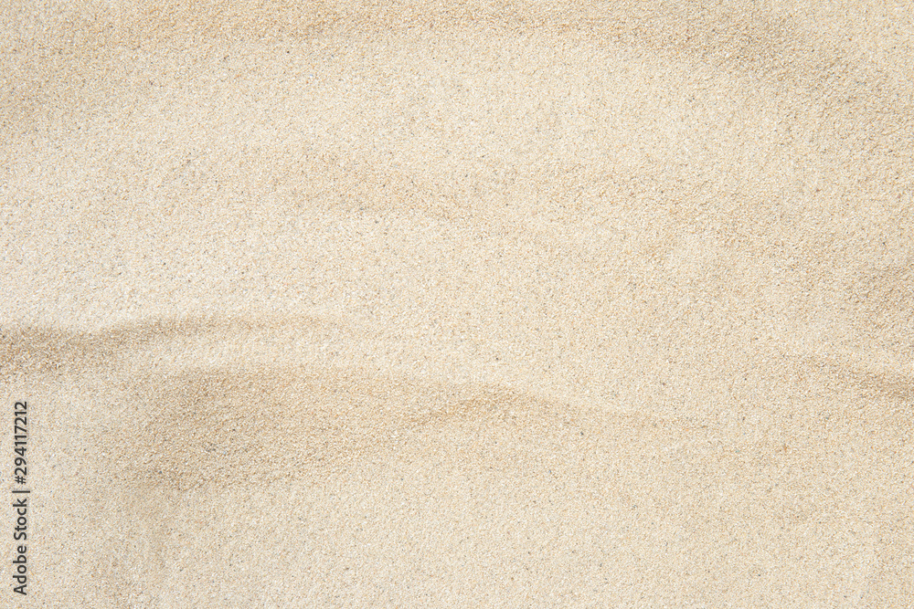 Poster full frame with fine sand on the beach and background texture.
