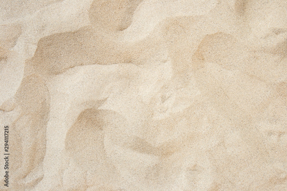 Poster full frame with fine sand on the beach and background texture.
