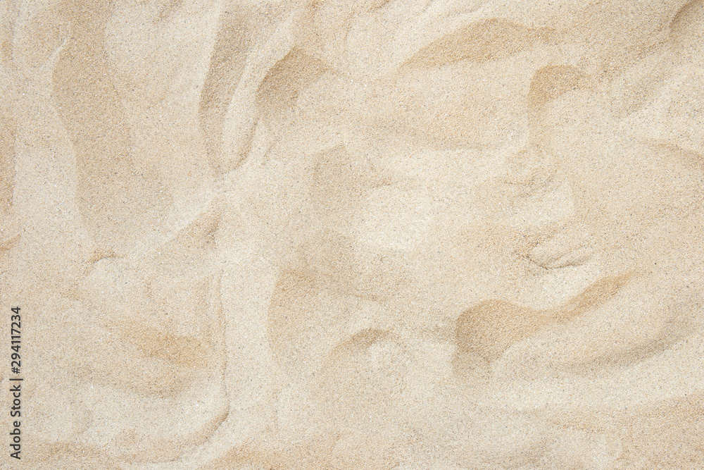 Poster full frame with fine sand on the beach and background texture.