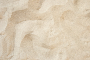 Full frame with fine sand on the beach and background texture.