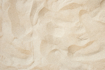 Full frame with fine sand on the beach and background texture.