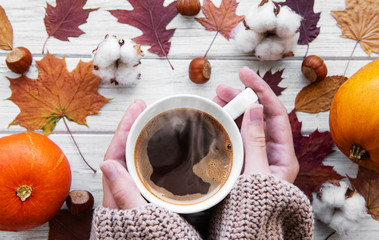 Hand holding warm coffee