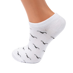white and black  socks in the cage and stripes or polka dot on a white isolated background