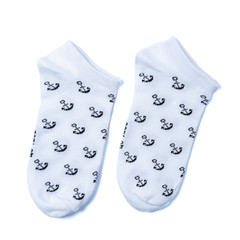 white and black  socks in the cage and stripes or polka dot on a white isolated background