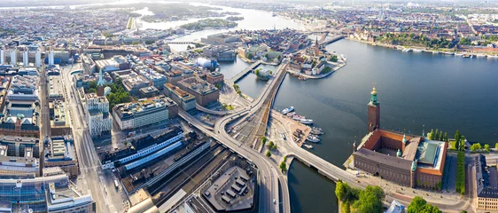Deurstickers Stockholm, Sweden. Panorama of the city. Stockholm City Hall overlooks the business and historical part of the city. Built in 1923, red brick town hall © nikitamaykov