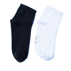 pair of white and black socks on an isolated white background