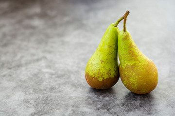Fresh pears, autumn fruitisolated on gray background with copy space.
