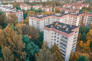 aerial view of the lost city of Pripyat. a lot of empty concrete floors overgrown with trees....