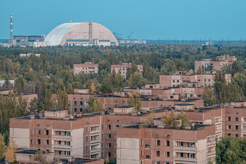 view of the new safe confinement arch at the Chernobyl nuclear power plant through the prospect of abandoned Pripyat. NSF is a new sarcophagus for safe deactivation work