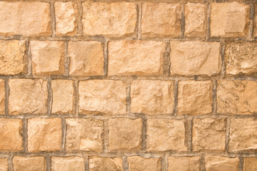 Background texture of the old fortress stone wall. Conceptual background for designers. Selective focus.