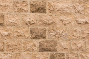Background texture of the old fortress stone wall. Conceptual background for designers. Selective focus.