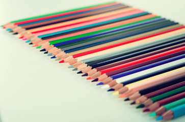 colored pencils lying in row