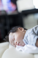 adorable baby sleeping on stomach