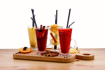 Hot fruit drinks - raspberry with orange, lime with ginger, cranberry with honey and pear with lime tea
