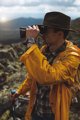 Naklejka premium young ambitious man is interested in nature, landscape, wild life, close up side eview photo
