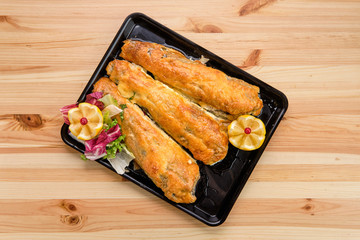 Fototapeta na wymiar Baked fish in batter on tray