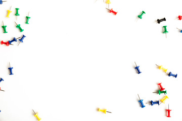 Colorful push pins isolated on white background