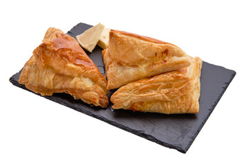Puff pastry with cheese on slate plate