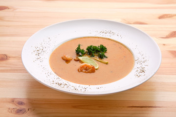 Shrimp soup on wooden table