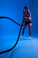 young awesosme woman in fashion sportswear preparing for a competition, cross fit program. full length photo