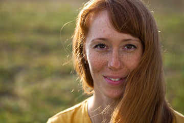Portrait close up of young red-hair woman